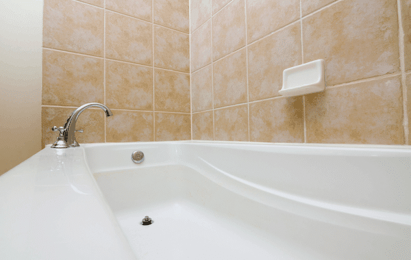Clean bathtub with tiled wall. How do I clean my bathtub?