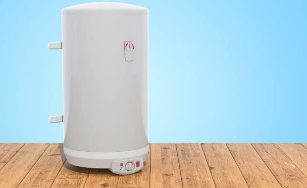 Electric water heaters on wooden planks.