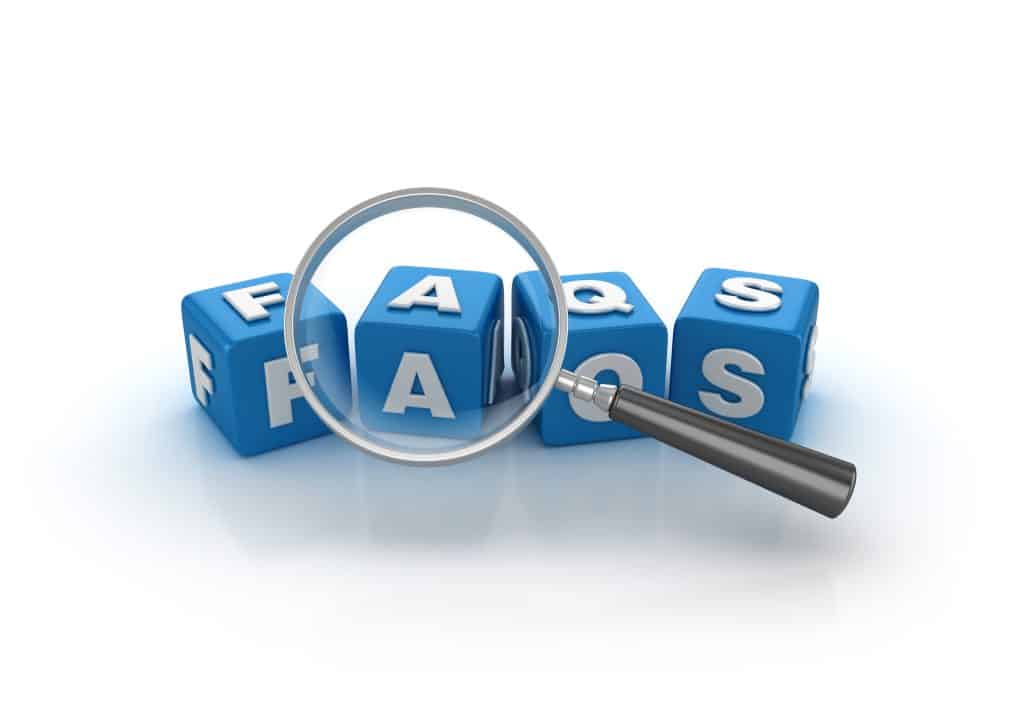 FAQs: Buzzword Cubes with Magnifying Glass on a White Background. High-Efficiency Condensing Tankless Water Heaters by Benjamin Franklin Plumbing of Dallas, TX