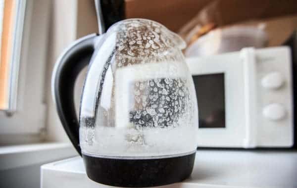 Coffee pot in a kitchen stained with spots by hard water residue