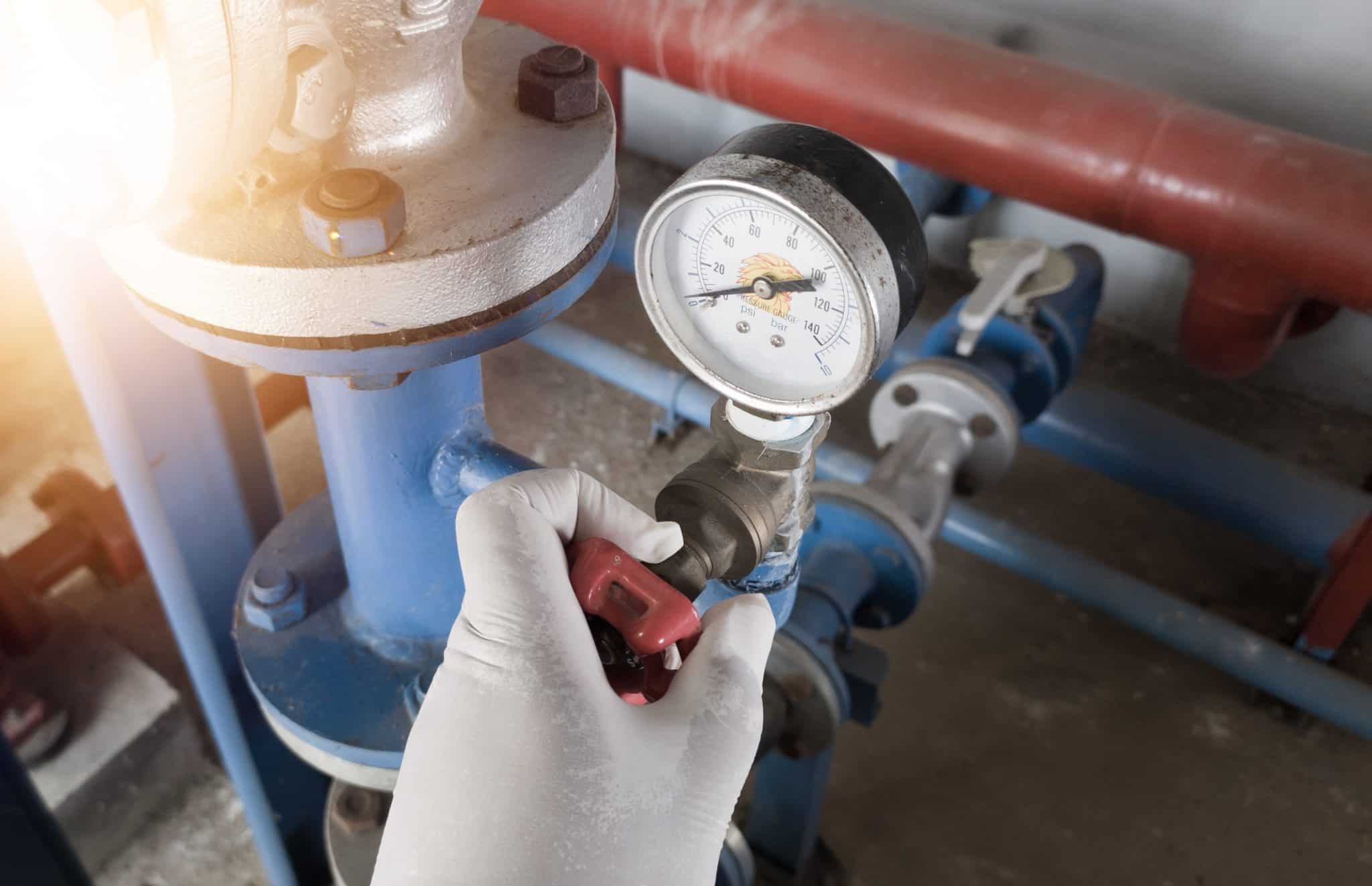 Checking the water pressure regulators in the system.