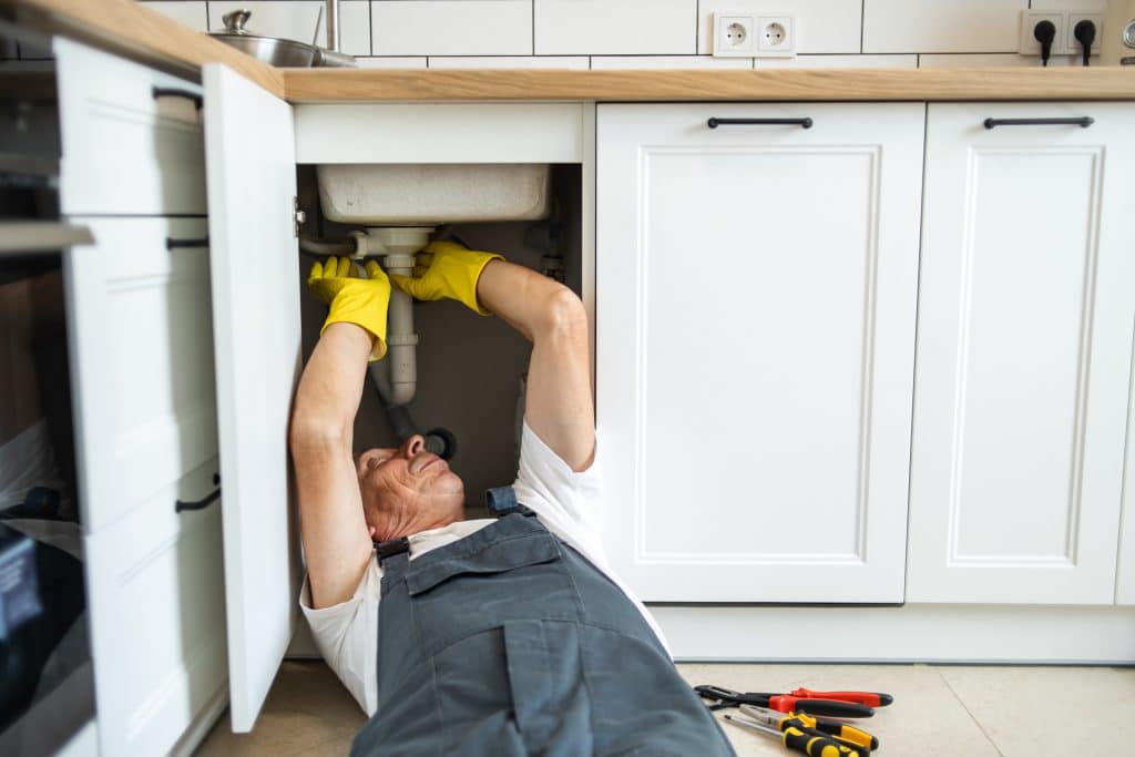 In plumbing emergencies, the plumber provides focused attention and expertise, carefully examining the sink and its components to ensure proper functionality and address any issues that may arise.
