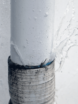 A home water pipe leaks water.