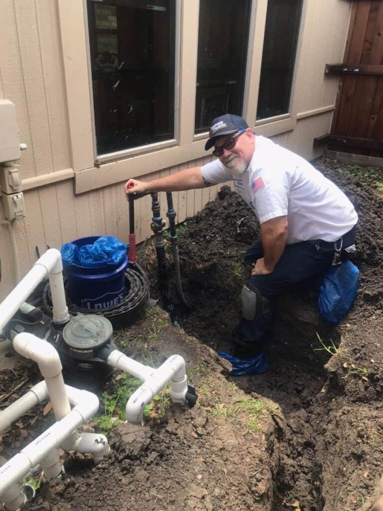 A Benjamin Franklin employee installs a new gas line.