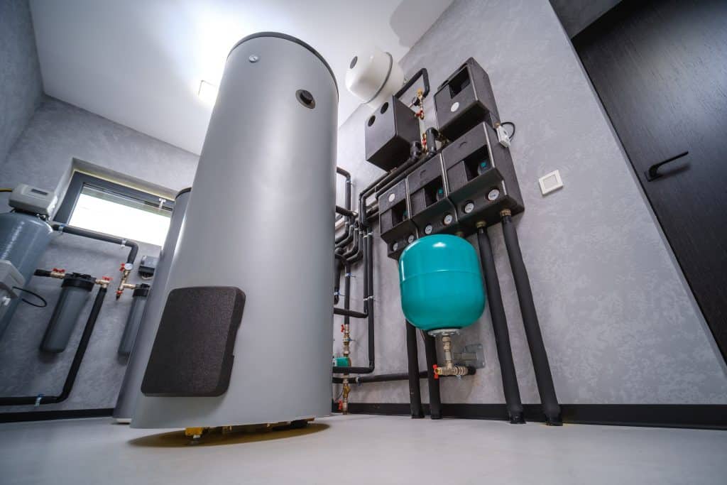 Modern tank electric water heater room in the house, equipped with an automatic control unit for the water heating system.