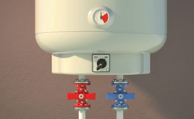 Tankless electric water heaters on a brown-colored wall.