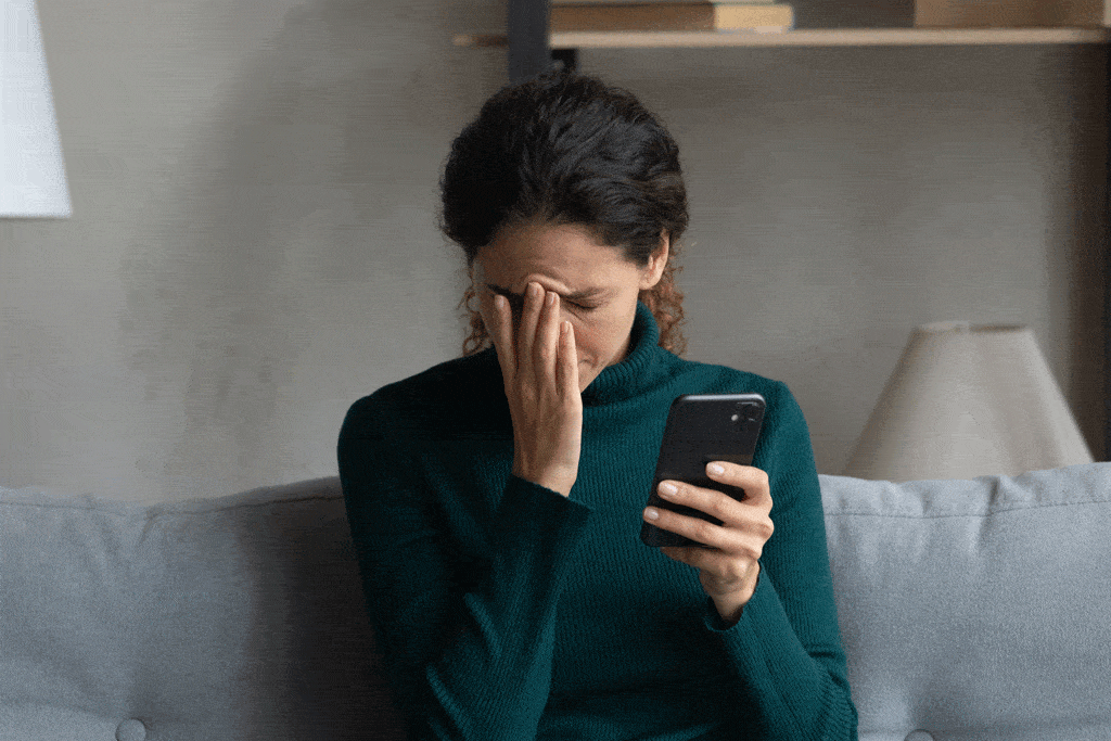 lady sitting on couch frustrated | water heater repair dallas tx frisco tx