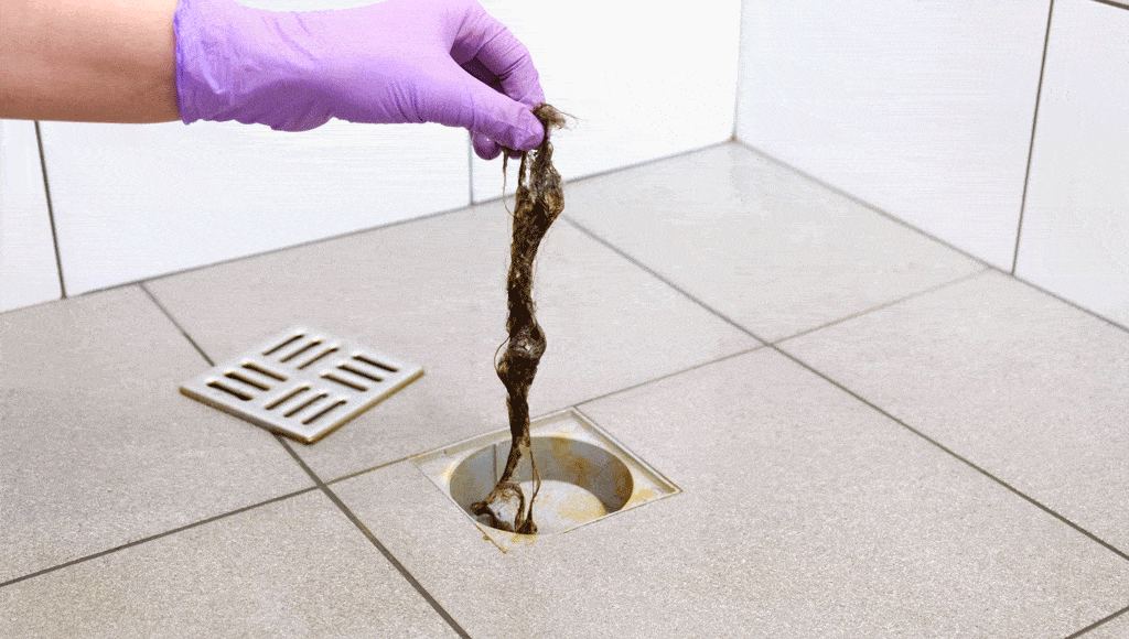 hair coming out of clogged drain | drain cleaning service plano tx dallas tx
