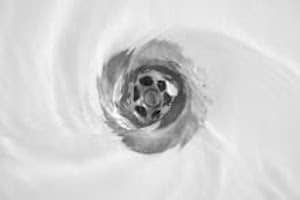 Water flushing down a bathtub drain