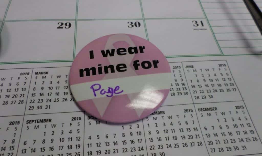 A button displays the name of a loved one for Breast Cancer Awareness Month.