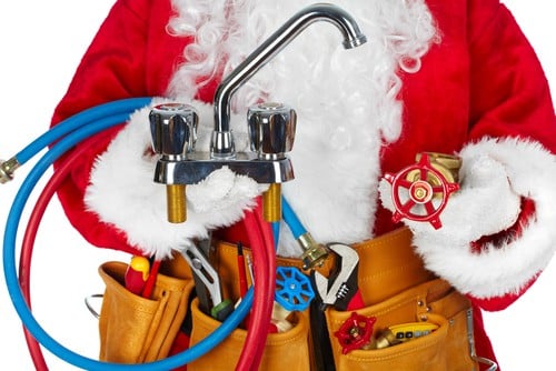 santa holding plumbing tools