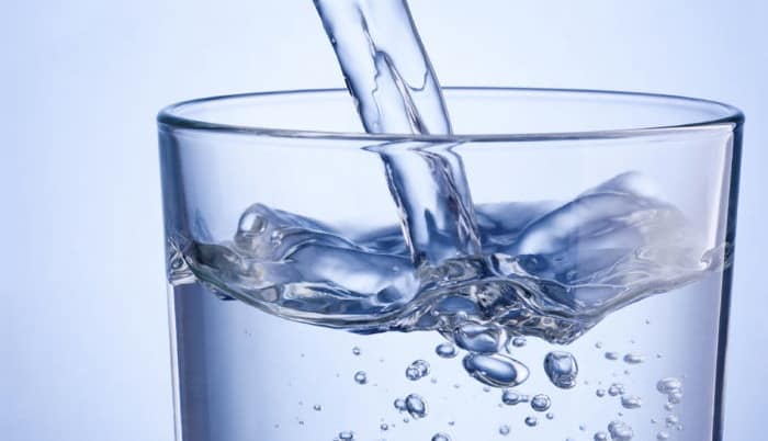 Water pours into a glass.