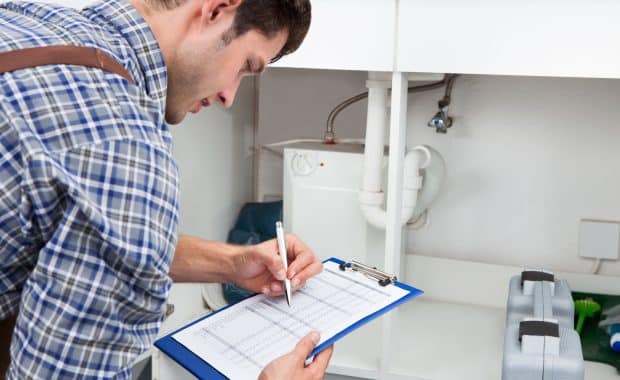 Plumbing Inspections With Clip Board.