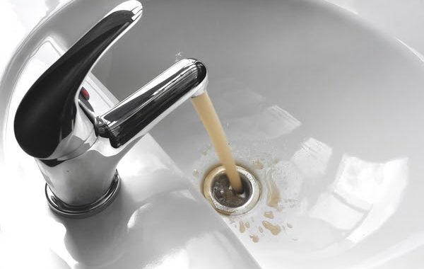 wastewater draining from a sink's faucet. The coronavirus may live and spread in wastewater, though it is unlikely.