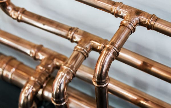 Copper pipes connected by three-way joints - How Does Water Move Through Your House?