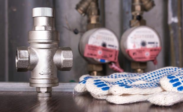 A new water pressure regulators and a gloves.